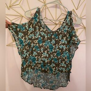 Lucy love small top. Hangs off the shoulders. Crop top in front and back is long